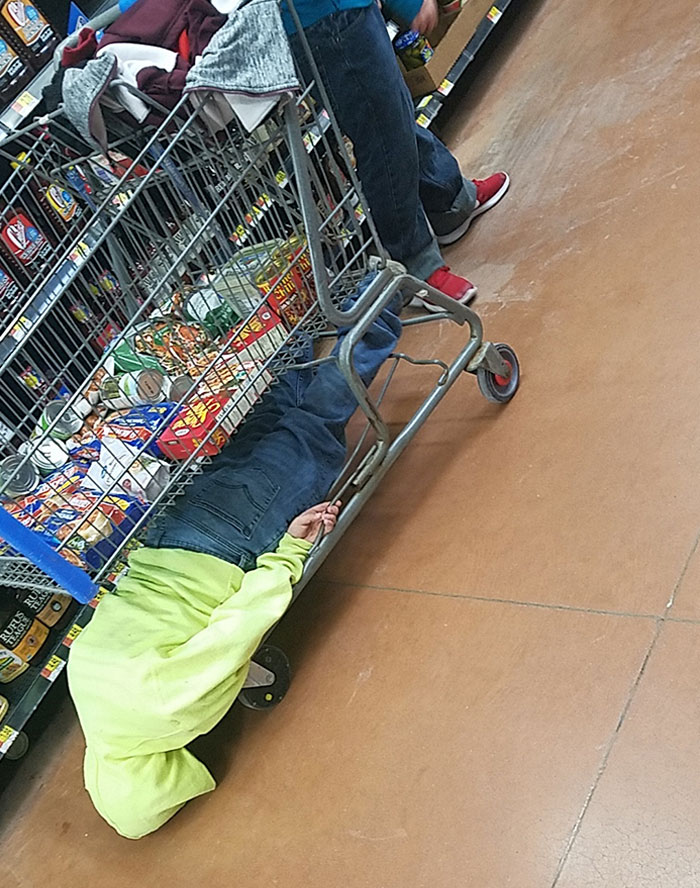Kid At Walmart Dragging His Head On The Ground While Mom Was Shopping