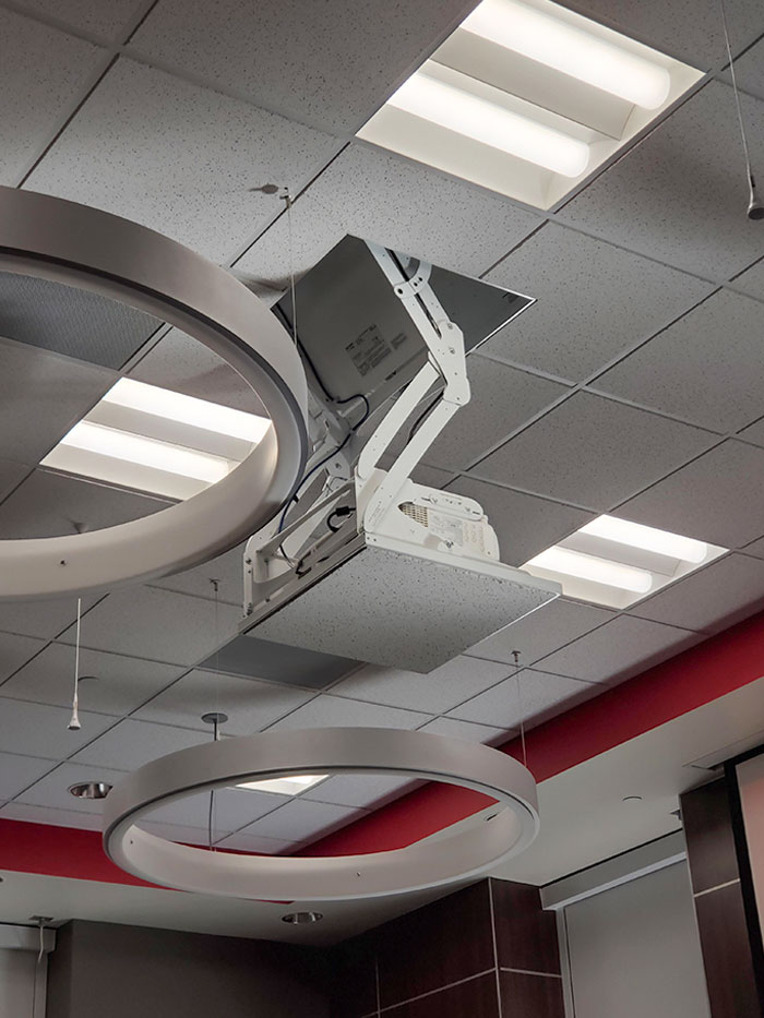 This Projector That Comes Down From A Ceiling Tile