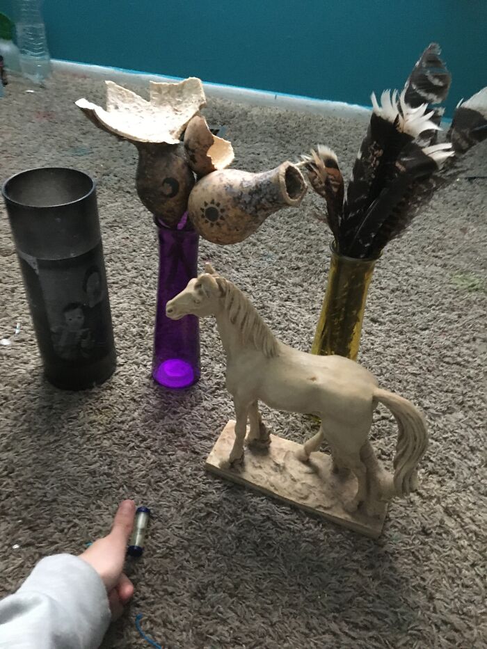 (Left To Right) Candle Holder With Pictures Of Dead People On It, Vase Of Dead Gourds, Vase Of Various Bird Feathers (Mostly Wild Turkey), Then A Horse Statue Made Entirely Out Of Fish Bone, And An Hourglass The Size Of My Thumb