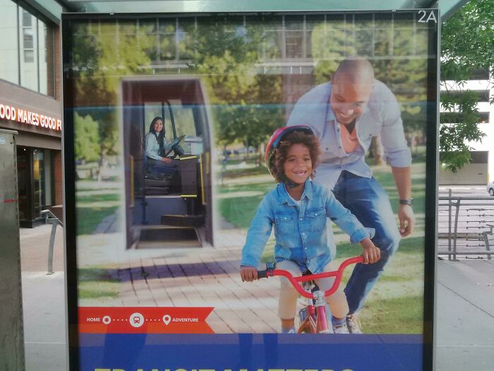 This Really Odd Advertisement For Transit Around My City (Where Did The Bus Driver Come From?)