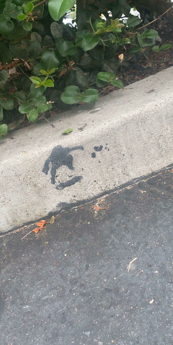 This Tar Stain On A Curb Kinda Looks Like A Skateboarder Doing A Trick
