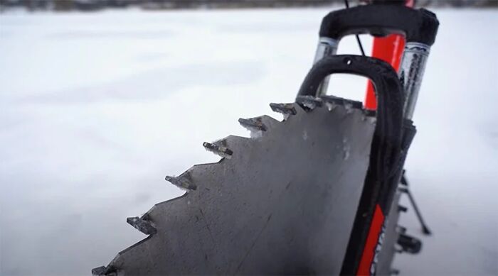 Man Replaces Bike Tires With Circular Saws And Goes For A Spin On A Frozen Lake