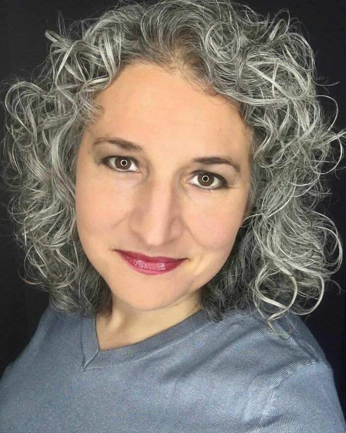 “Like My Father And Brother, I Had Silvery Strands Of Hair Emerging In My 20s. It Was Nothing Major Though, And An Occasional Trip To The Salon Disguised Them Nicely. Then, At Age 36, I Gave Birth To My Fourth Son And Became Very Sick. I Blamed My Mix Of Symptoms On Being An Exhausted Mama To So Many Kiddos Under Age 7, But Then My Hair Started Falling Out... And What Remained Was Turning Grey Seemingly Overnight.
after 10 Months Of Misdiagnoses, I Was Finally Properly Diagnosed With An Autoimmune Disorder - One With A Myriad Of Symptoms Including ‘Rapid Premature Greying’. Like Many People With Autoimmune Diseases, Most Could Not Tell How Sick I Was, And I Didn’t Want Them To Know. I Made More Frequent Trips To The Salon, Determined Not To Look ‘Like An Old Lady Before I Was Even Forty’.
then One Day Shortly After My 39th Birthday, I Proudly Returned From The Salon With A Full Head Of Newly-Colored Hair And Asked My Husband, ‘How Does It Look?’ He Asked Permission To Speak Freely And Gently Explained My Hair Looked So Unhealthy - Almost Plastic - And It Didn’t Flatter Me At All. He Reassured Me, ‘I Will Always Support You Doing Whatever You Need To Do To Feel Beautiful And Confident, But Would You Ever Consider Just Letting It Go Grey?’
i Considered His Suggestion For A Long Time Before Deciding He Was Right; My Hair Looked Terrible - And Extremely Fake. More Than That, My Motivation To Cover Those Greys Was About Denying My Disease — And Why Was I Ashamed Of Something That Happened To Me And Was Well Beyond My Control?
i Began The 18 Month Journey To Grow Out My Greys And Celebrated Achieving Remission From My Autoimmune Disorder Along The Way. Now, When People Ask, ‘Who Colors Your Hair That Beautiful Shade Of Silver?’ I Respond Boldly, ‘It’s All Natural! Achieved Through Years Of Raising Four Sons And Battling An Autoimmune Disease’. The Universal Response? ‘Well Good For You! It’s Stunning’.
and You Know What? I Agree With Them! My Grey Is Stunning... And So Is The Beautiful Story That Brought Me To This Day.” @fashionrusch #grombre #gogrombre #grombabe