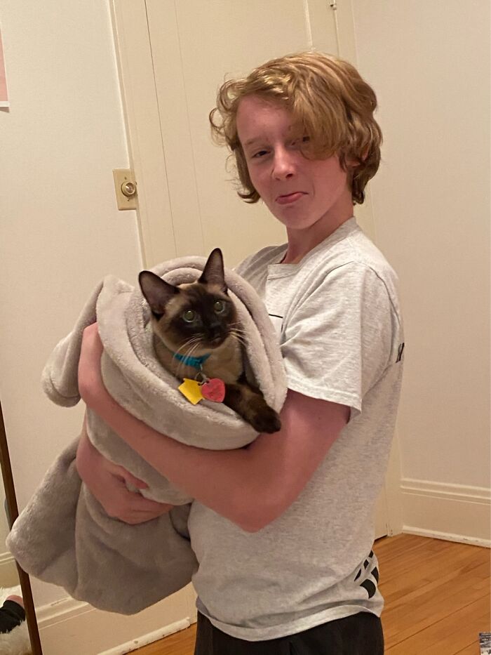 Here’s My Brother With Our Cat Rizzo. We Turned Him Into A Burrito.