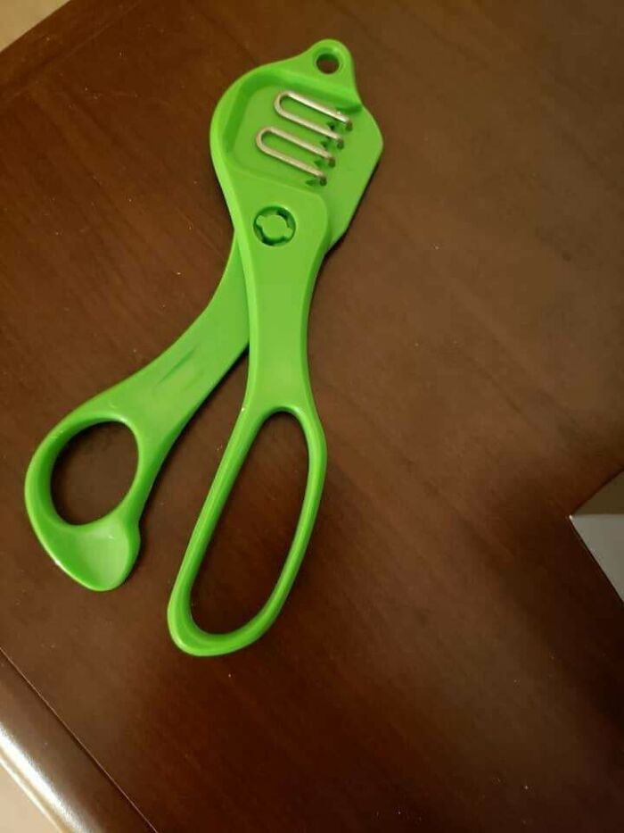 Green Plastic Scissor Handle With Metal Loops And Plastic Teeth. No Identifying Marks