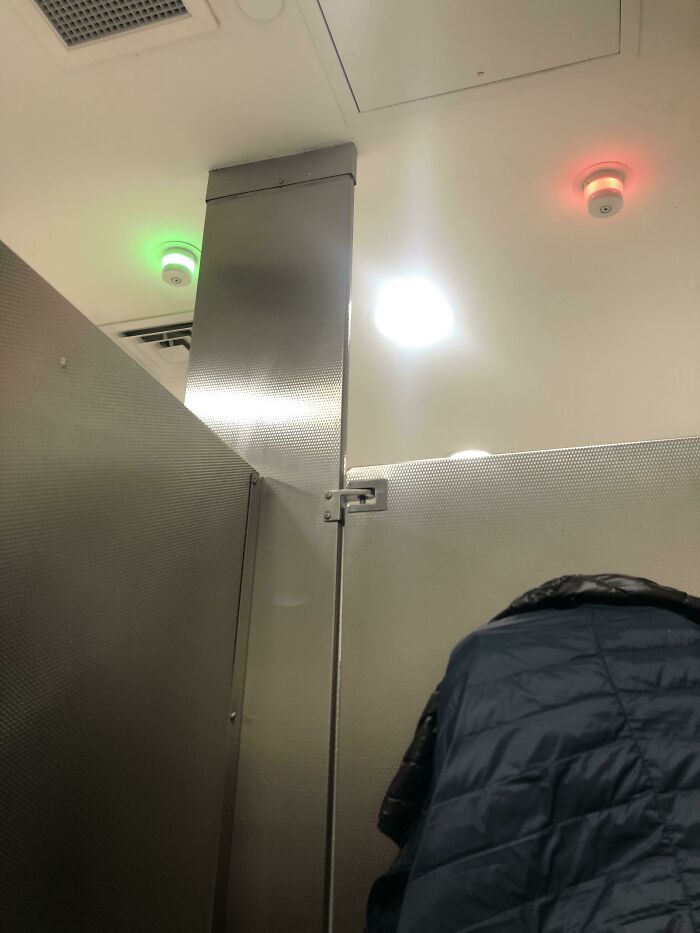 The Bathroom I’m In Has Red/Green Lights Above Them To Show If The Stall Is Vacant Or Occupied