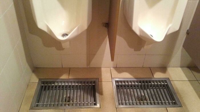 This Restroom Has Drains Under The Urinal For Those Who Miss The Mark