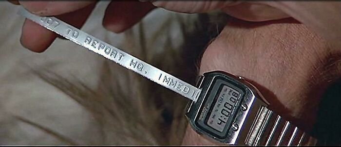 James Bond's Ticker-Tape Watch In "The Spy Who Loved Me" Prints Out Dymo Label Spray Painted Silver
