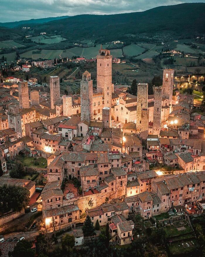 The Medieval Skyline Of San Gimignano, A Walled Hill Town With Towers Dating Back To The 13th Century In Siena, Tuscany, Italy