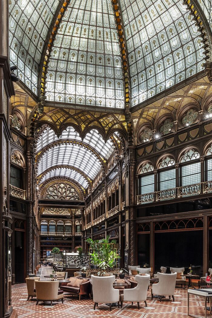 Eclectic Reception Area Under A Glass Dome In Párisi Udvar(Paris Court), A Former Bank Building Built In The 1910s Which Was Recently Restored And Renovated Into A Luxury Hotel In Downtown Budapest, Hungary