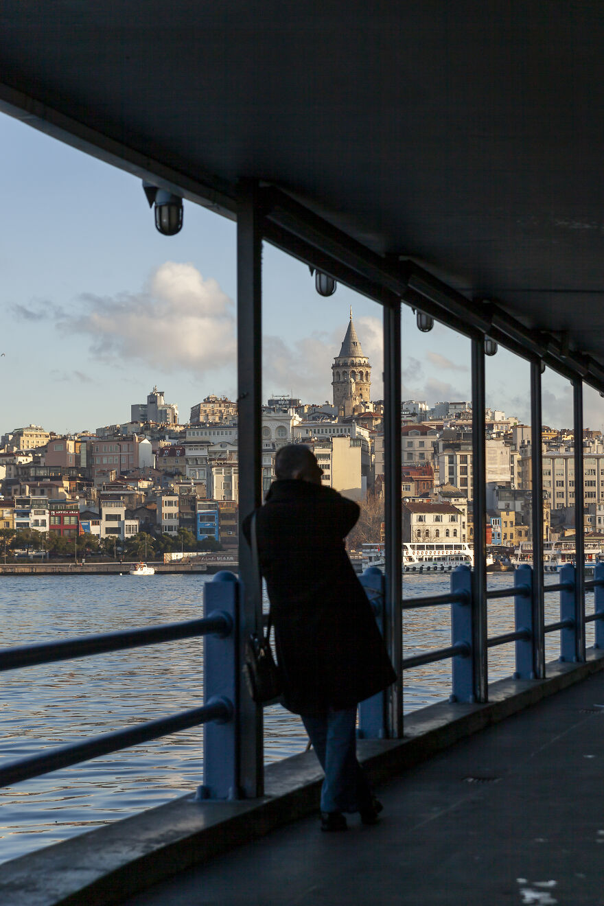 Galata Tower Is One Of My Favorite Places In Istanbul. I Have Many Shots Of It From Different Angles, At Different Light Conditions. In This Case, I Took It From The Bridge Walkway And I Like The Framing Of The Man And The Tower