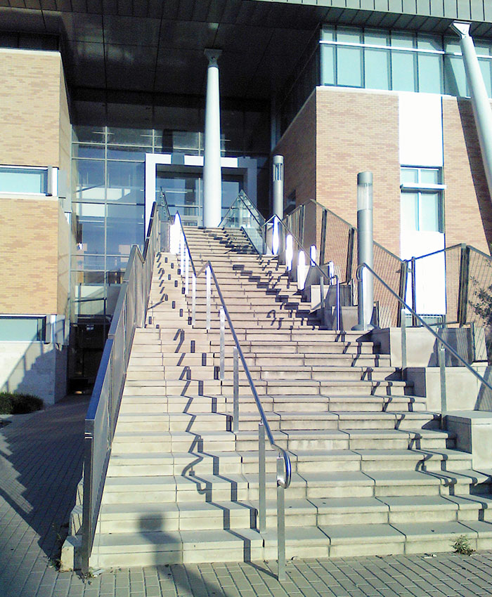 Handrail That Funnels People Onto Ever-Narrower Steps