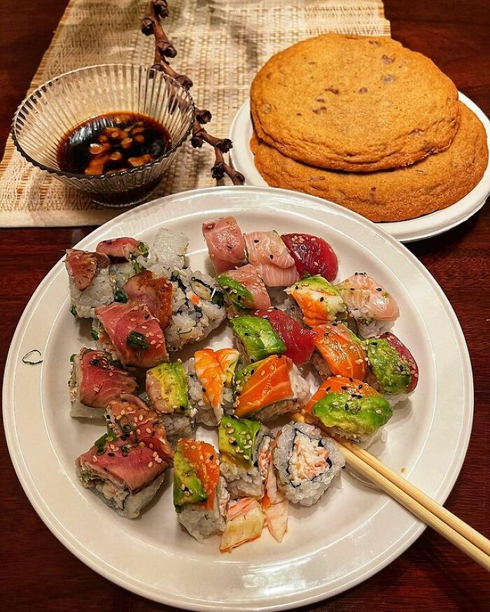 A Variety Of Sushi And Extremely Large Chocolate Chip Cookies