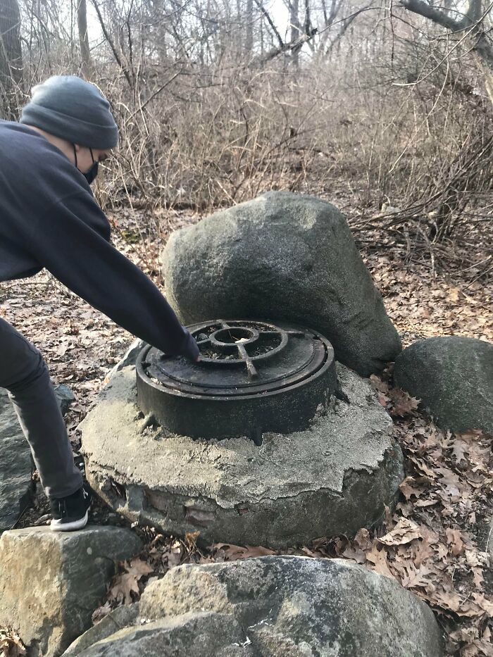 This Structure I Found While Walking In The Woods, The Metal Bit Is About 2 Feet Wide And Looks Like It Could Uncomfortably Fit A Person In It. My Guesses Are A Well, Sewer Or Time Capsule. For Context I Live In Eastern Massachusetts. We Plan On Going Back To Open It