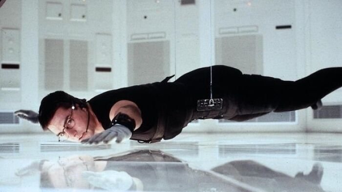 During The Vault Scene In Mission: Impossible (1996), Tom Cruise Kept Hitting His Head When Attempting To Hover Inches Off The Floor, So He Put English Pound Coins In His Shoes To Maintain His Balance