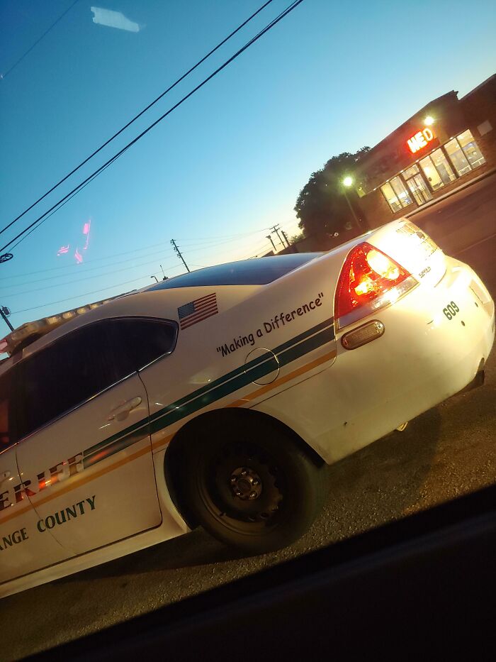 The Cop Cars In Orange Country Florida All Say Making A Difference In Comic Sans With Useless Quotation Marks. Makes It Seem Like They Aren't Making A Difference