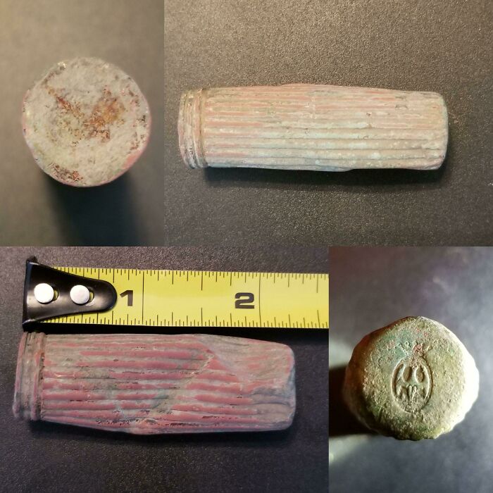 Weird Metal Tube (Now Dented) Found Metal Detecting In Se Iowa On A Farmstead That Stood From The 1890s-1960s. Seems To Be Made Of Copper, Found 4" Down, And Has A Bat-Like Symbol On One End. It's Closed On Both Ends And Feels Hollow