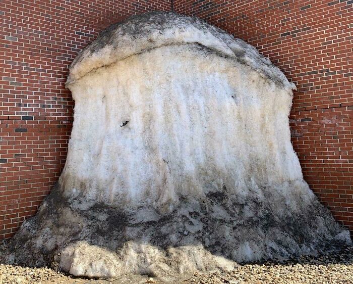 Snowpile In The Corner Of A Building That Refuses To Melt