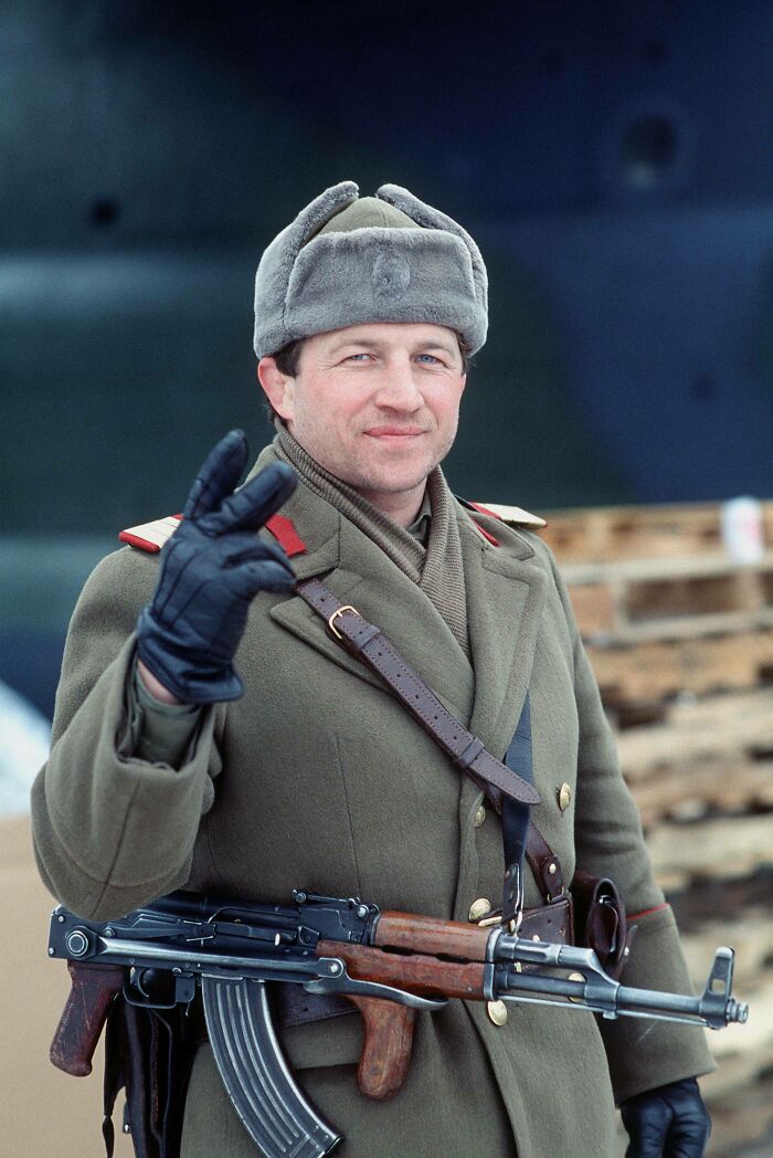 A Romanian Soldier Giving A Sign Of Victory After The 1989 Revolution, Having Removed The Communist Insignia From His Headwear