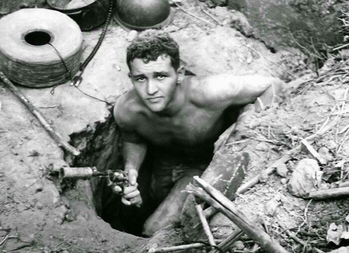 U.S. Soldier: Sgt. Ronald Payne, 21, Of Atlanta, Georgia, Emerges From A Viet Cong Tunnel While Holding A Silencer-Equipped Revolver (January 21, 1967)