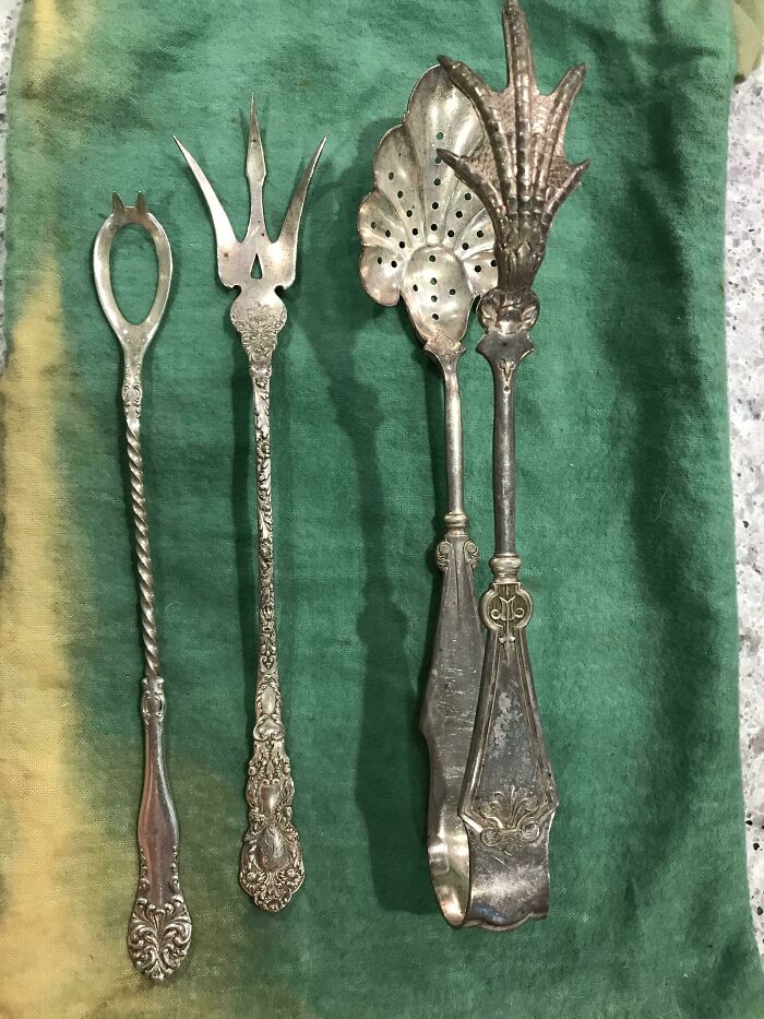Open Spoon With Spikes; Trident-Like Fork; Tongs With A Chicken Foot And A Perforated Spoon. All Antique Silver