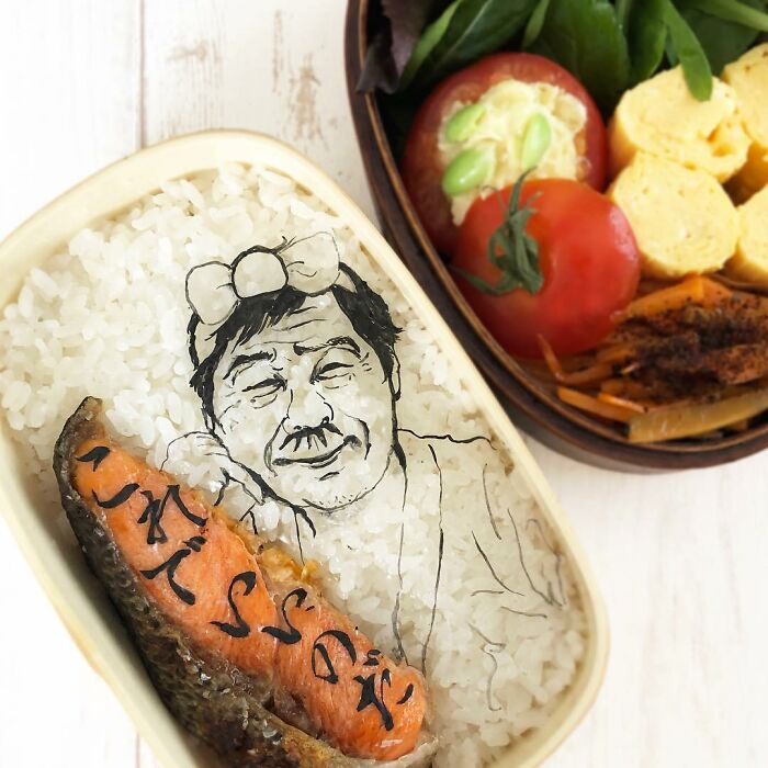 Bento artist creates detailed lunchbox featuring rice art and fish inspired by favorite TV shows, movies, and manga.