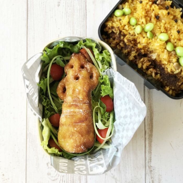 Bento artist lunchbox featuring creative food art with salad and seasoned rice, inspired by favorite TV shows and movies.