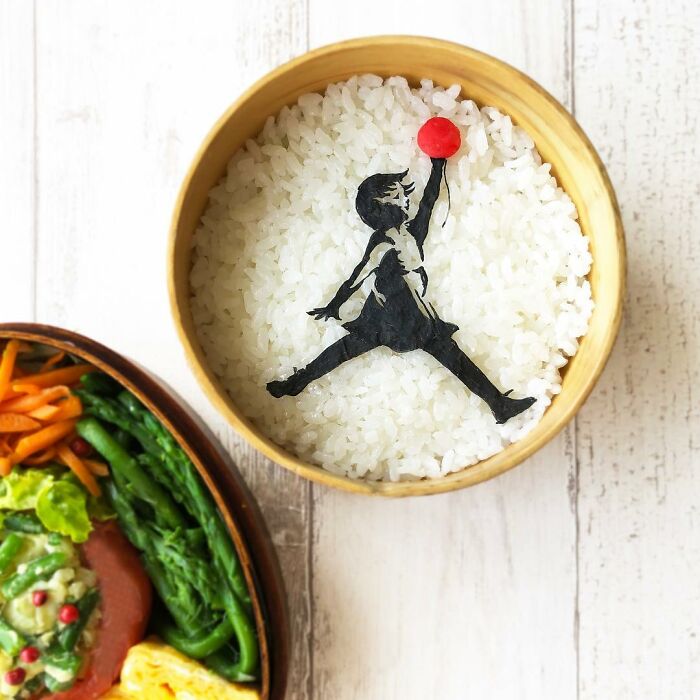 Bento artist creating detailed lunchboxes featuring favorite TV shows, movies, manga characters with creative food art.