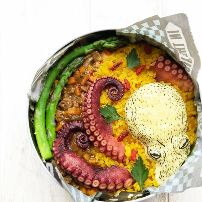 Bento artist lunchbox featuring octopus tentacles and rice, creatively designed inspired by favorite TV shows and manga.