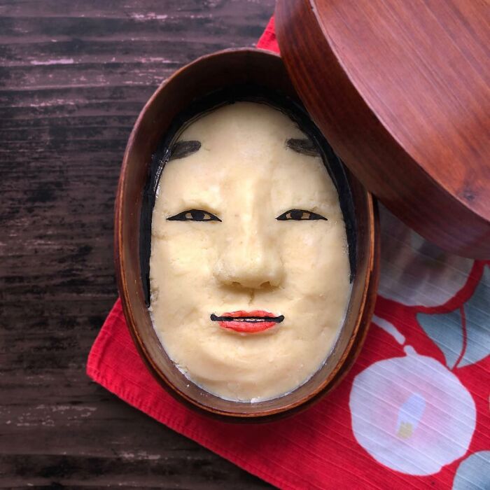 Bento artist creates detailed lunchbox featuring a character face inspired by TV shows, movies, and manga for her husband.