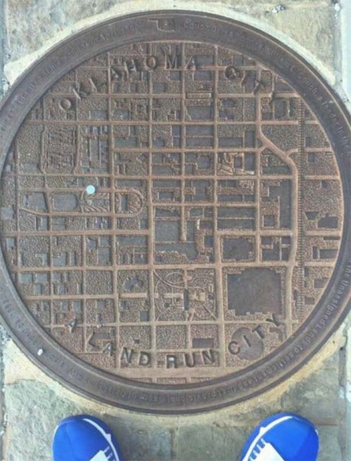 Oklahoma Man Hole Covers Have A City Map On, With A Blue Dot To Show Where You Are