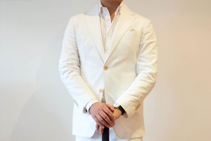 man in a white suit