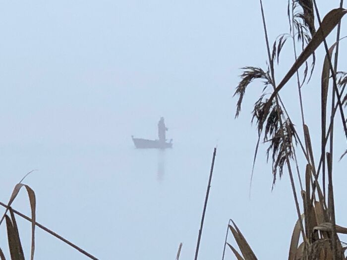 A Guy I Saw Fishing In His Boat On A Very Foggy Day...