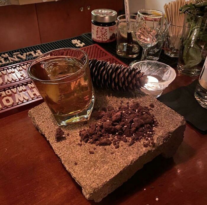 Cocktails In The Wild... Manhattan Served On A Rock With A Side Of Dirt And Pine Cone