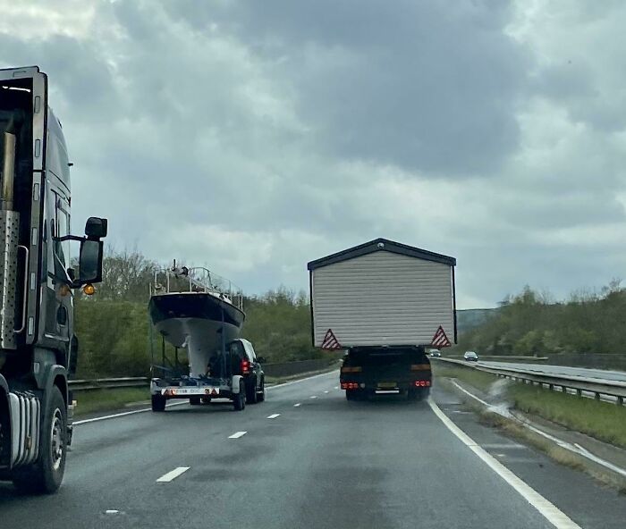 A House Overtaking A Boat On The A30 Today