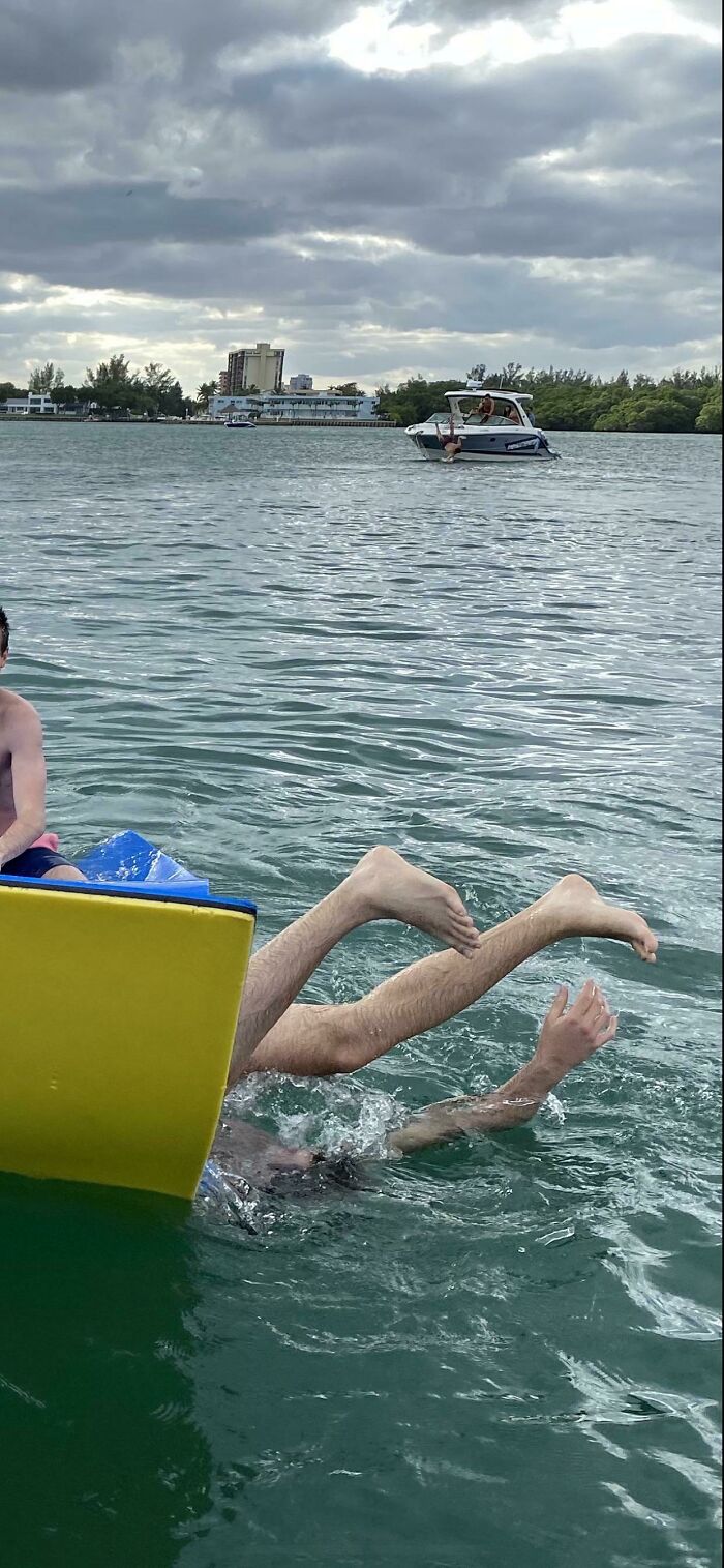 I Got A Pic Of My BF Falling Off A Floaty And Just Realized There Was A Guy Falling Off A Boat At The Same Time