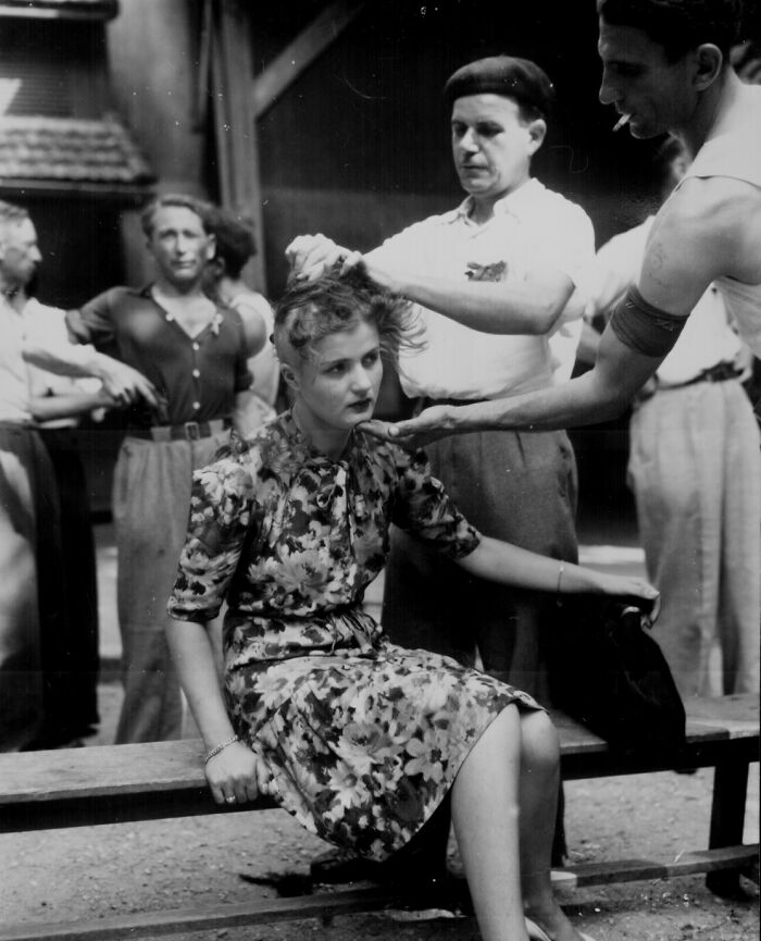 A Woman Is Humiliated For Having Had Personal Relations With The Germans. In The Montelimar Area, France, French Civilians Shave Her Head As Punishment. August 29, 1944
