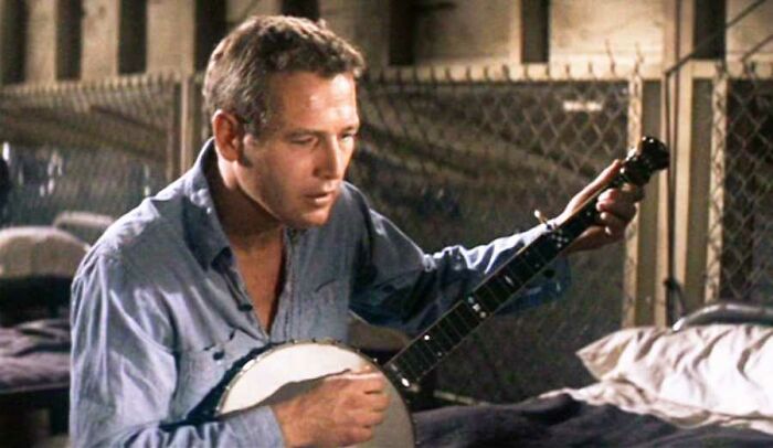 Cool Hand Luke(1967) Newman Insisted On Learning To Play The Banjo For The "Plastic Jesus" Scene. On The Last Take, He Got Frustrated After Making An Error, Which Made Him Increase The Pace Of The Song. He Told Director Stuart Rosenberg "I Could Do It Better". He Replied "No One Could Do It Better"