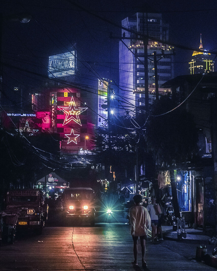 Another Dark Street Scene In Guadalupe. Slums Juxtaposed Against The Neon Skyscrapers Of Makati And Bgc