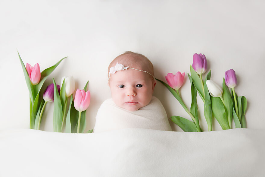 Sweet 12 Day Old Baby Girl Sleeping With Fresh Cut Tulips