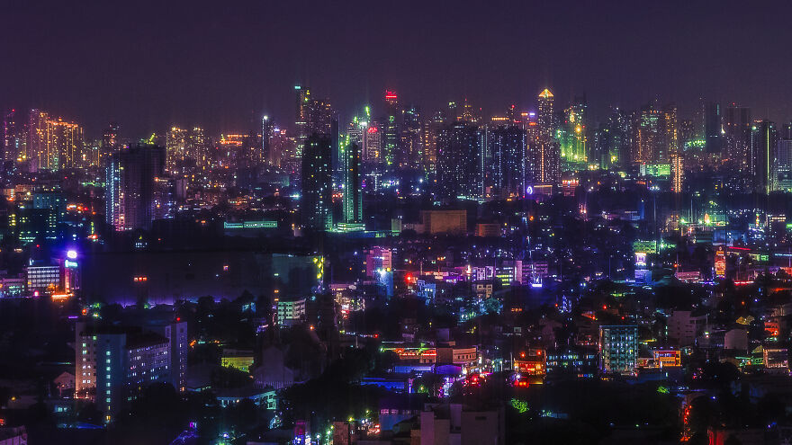 A Sprawling Aerial Cityscape Of The Metro Manila Skyline, Showing 5 Of Its Cities In One Picture
