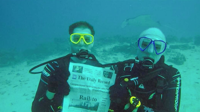 My 87-Year-Old Grandpa Learned How To Scuba Dive In The Past Year So He Could Visit The Shipwrecks In Palau (He’s A Huge WWII History Buff) And Posed With His Local Newspaper
