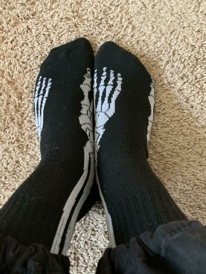 This Pair Of Skeleton Socks With The Top View Of The Foot Printed On The Sides. Also Two Right Feet