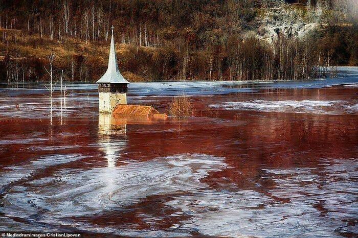 The Submerged Romanian Village Of Geamana, Flooded In 1978 To Make Way For A Large Copper Mine. The Relics Now Sit In A Colorful Toxic Stew