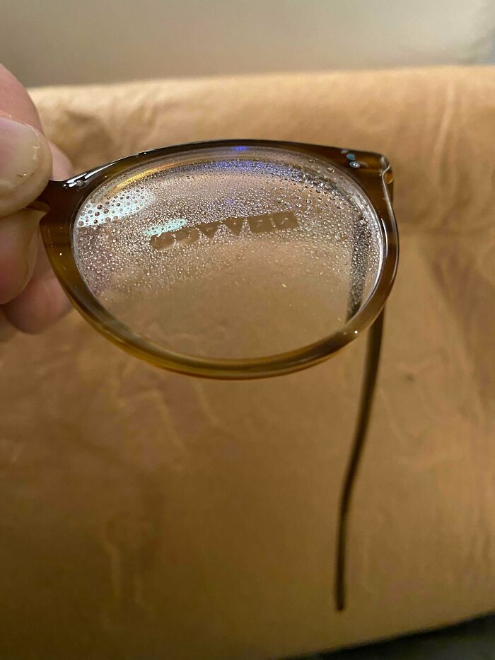 Oliver Peoples Geometric Logo Is Revealed On The Lens When Sprayed With Cleaning Solution