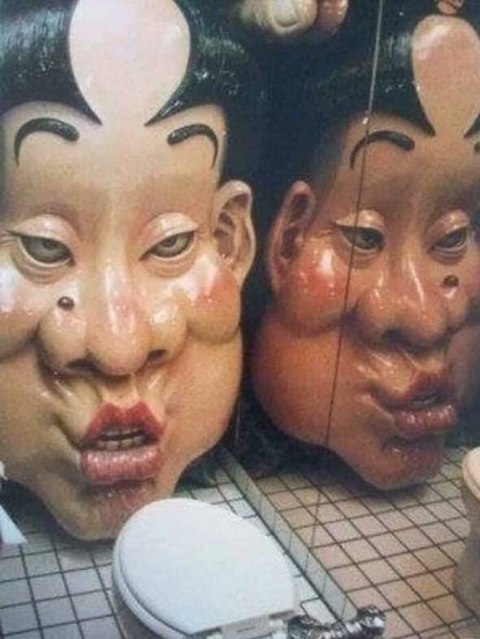 Located At A Bar In Shinjuku, Japan. There Is A Bathroom With A Gaint Head Located Infront Of The Toilet. Activated By The Pressure From The Seat, The Face Sings A Strange Drunken Tune And Slowly Moves Towards You… Making The Room Smaller And Smaller, Until Its Lips 'Kiss' Your Knees
