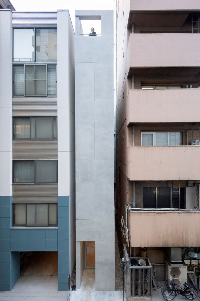 This Skinny Office Building Squeezed In An Alley Between Two Buildings In Tokyo