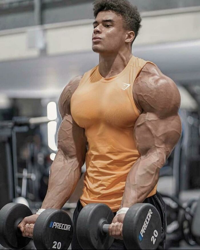 Guys Triceps Are So Large That Light Itself Bends Around Them
