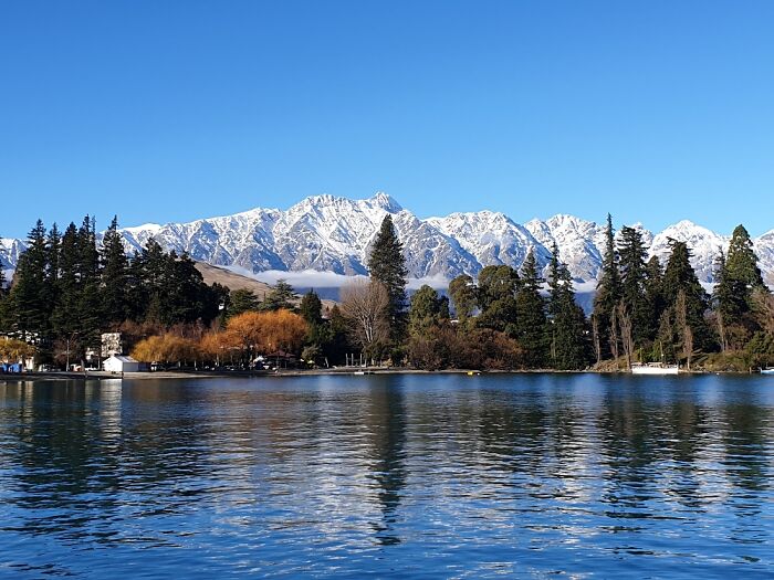 Queenstown, Nz. The Remarkables Mountain Range Against The Blue Sky.