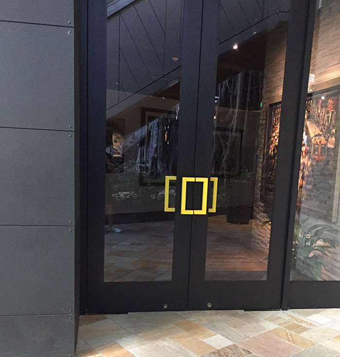 National Geographic Gallery Uses Its Logo As A Door Handle